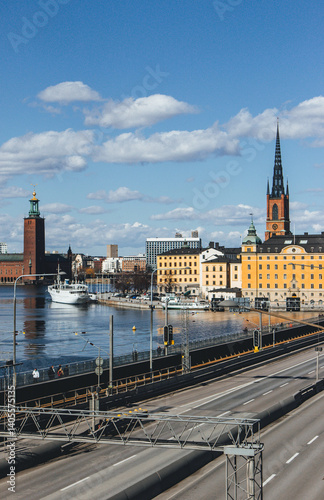 Canvas Print panorama of stockholm on beautiful sunny day with water reflections and clouds