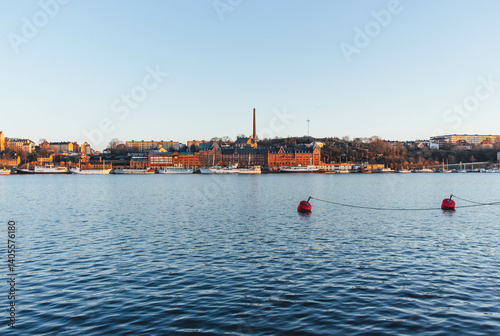 Canvas Print view of the old town of stockholm at sunset with sea waters blue and clear sky