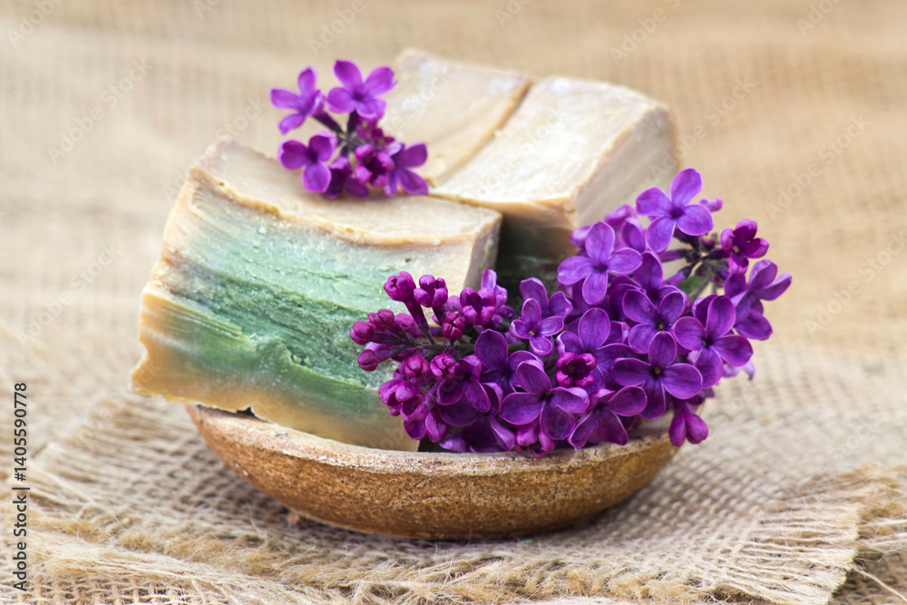 bar of natural soap and lilac flowers - aromatherapy