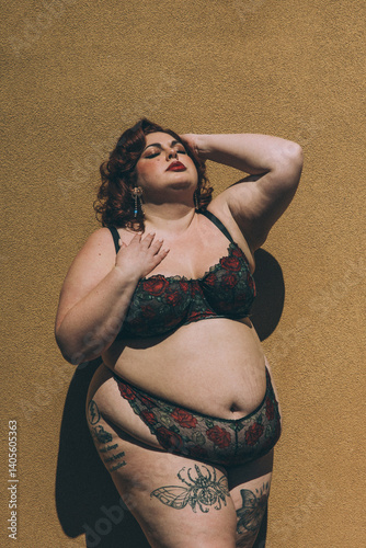 Plus size old Hollywood lingerie model outdoors