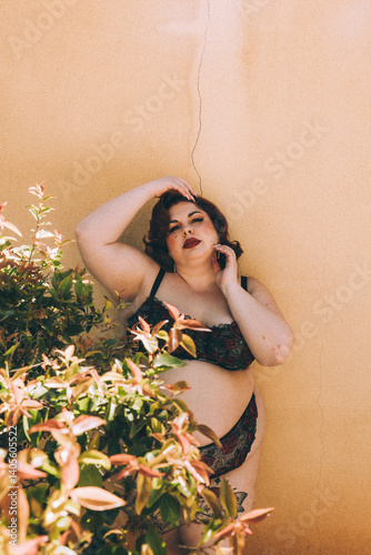 Plus size old Hollywood lingerie model outdoors