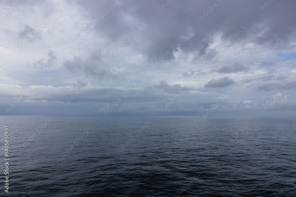 Fototapeta premium Beautiful peaceful Atlantic Ocean with gloomy cloudscape still waters