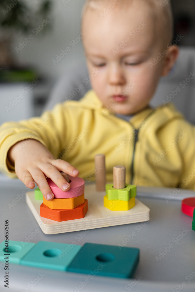 Baby is busy with educational toy, Closeup, selective focus. Baby is busy with educational toy, Closeup, selective focus.