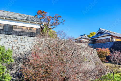 Kanazawa Castle Park with the stone castle and blue sky in Kanazawa photo