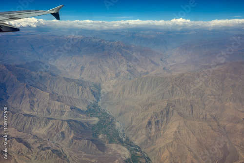Moments before landing in Arequipa, the window reveals a surreal world—volcanic peaks, craters, and vast highlands shaped by ancient fire.