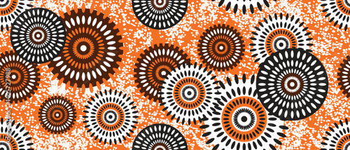 African ethnic traditional yellow, tangerine pattern. seamless beautiful Kitenge, chitenge style. fashion design in colorful. Geometric circle abstract motif. Floral Ankara prints, African wax prints.