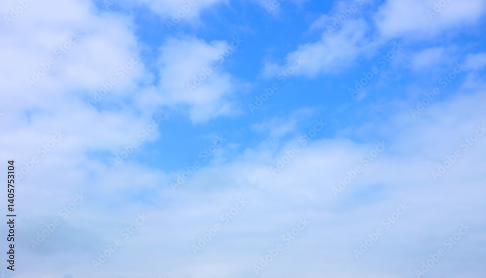 Beautiful blue sky background with fluffy clouds