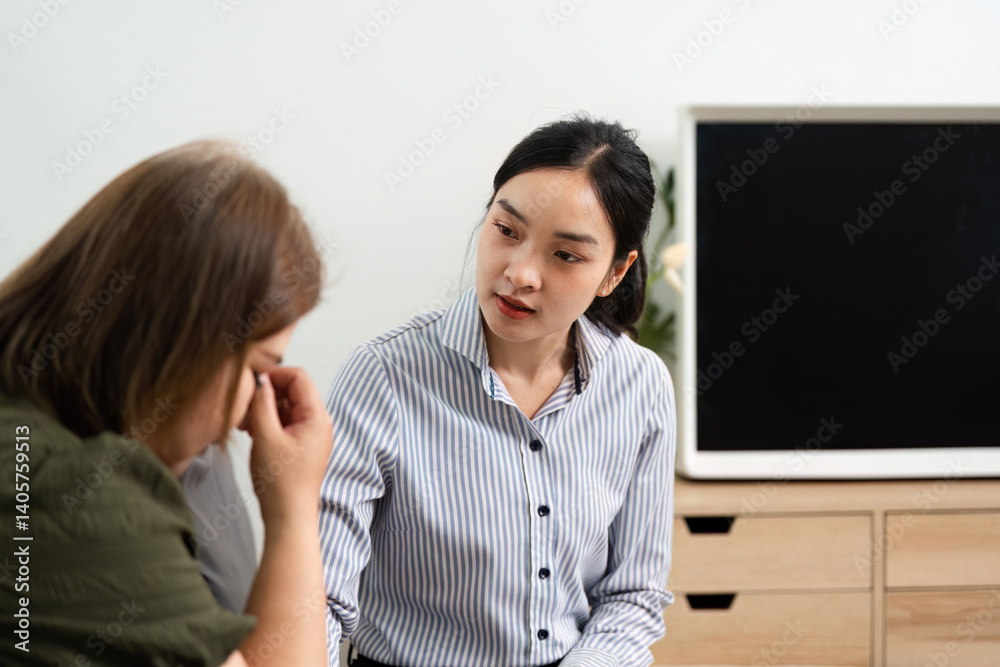 Empathy and Therapy. A psychiatrist provides a safe space for a client expressing emotions during a session.