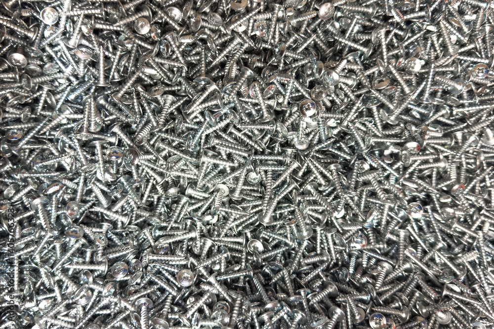 Closeup of assorted stainless steel screws in a manufacturing workshop Closeup of assorted stainless steel screws in a manufacturing workshop