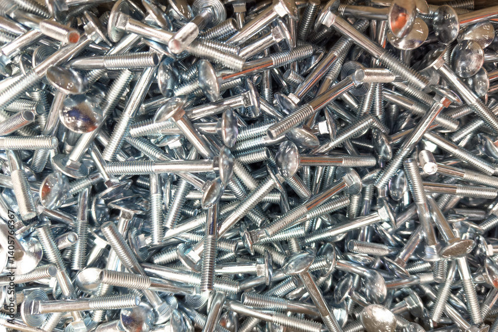 Closeup view of assorted steel screws and bolts in a workshop setting Closeup view of assorted steel screws and bolts in a workshop setting