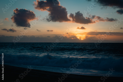sunset over the sea in nazare potugal