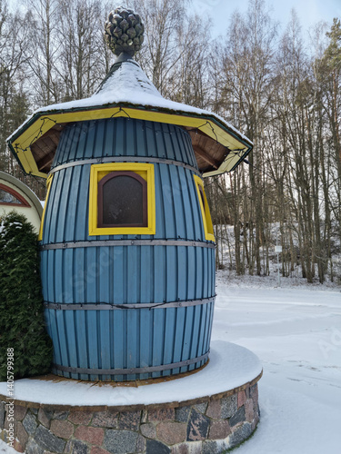 Tiny dwarf village hidden in the forest. Snow covered elf houses. Whimsical travel place.