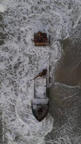 Aerial view of the Manzanillo Shipwreck against Costa Rica's lush tropical forest and pristine coastline. Circle Dolly Shot