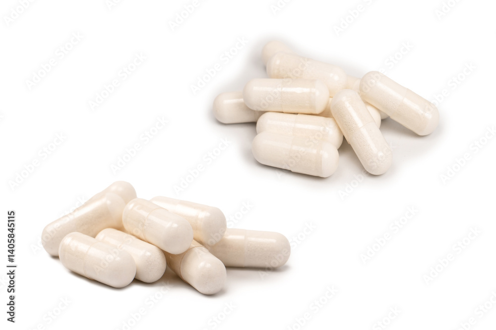 White pill capsule isolated on a white background. White pill capsule isolated on a white background.