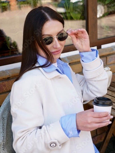 Smiling Woman Relaxing In Cafe With Morning Coffee During Work Break