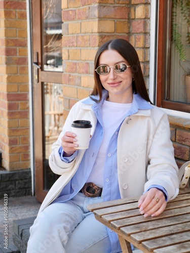 Smiling Woman Relaxing In Cafe With Morning Coffee During Work Break