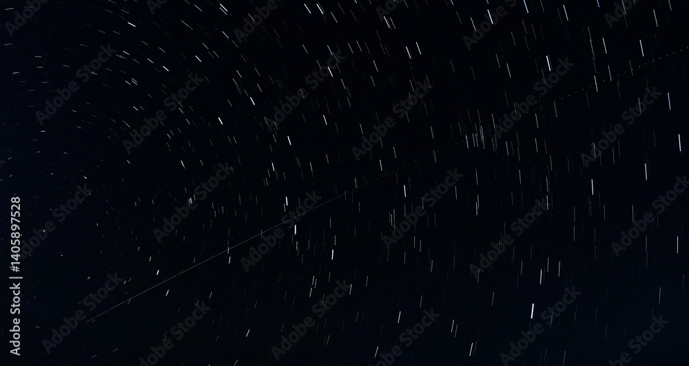 Star Trails and Airplane Trail in the Night Sky