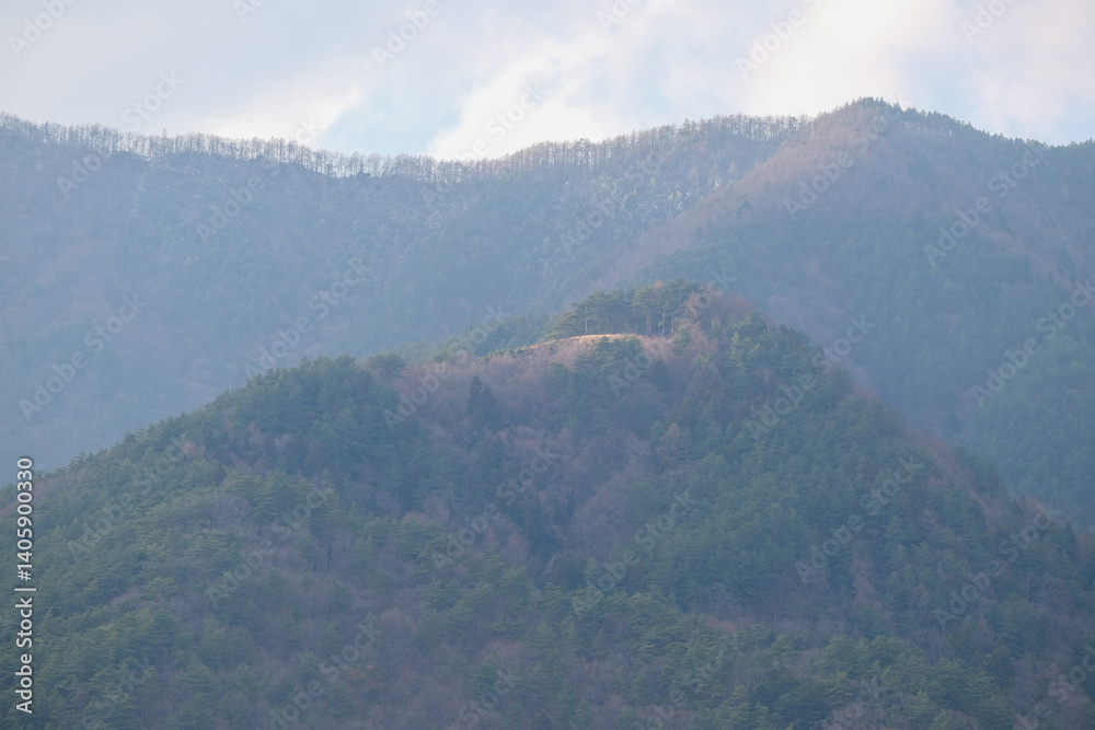 Naklejka premium mountains in the fog