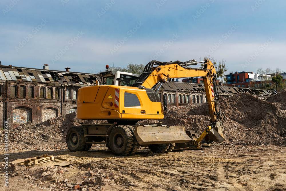 Excavator at work in the Gdansk Stocznia, old shipyard Excavator at work in the Gdansk Stocznia, old shipyard