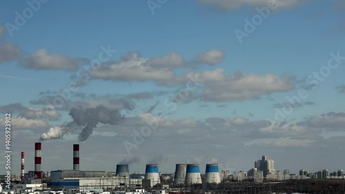 Timelapse. Pipes incinerator plant in an urban neighborhood. The plant's pipes pollute the air in the city.