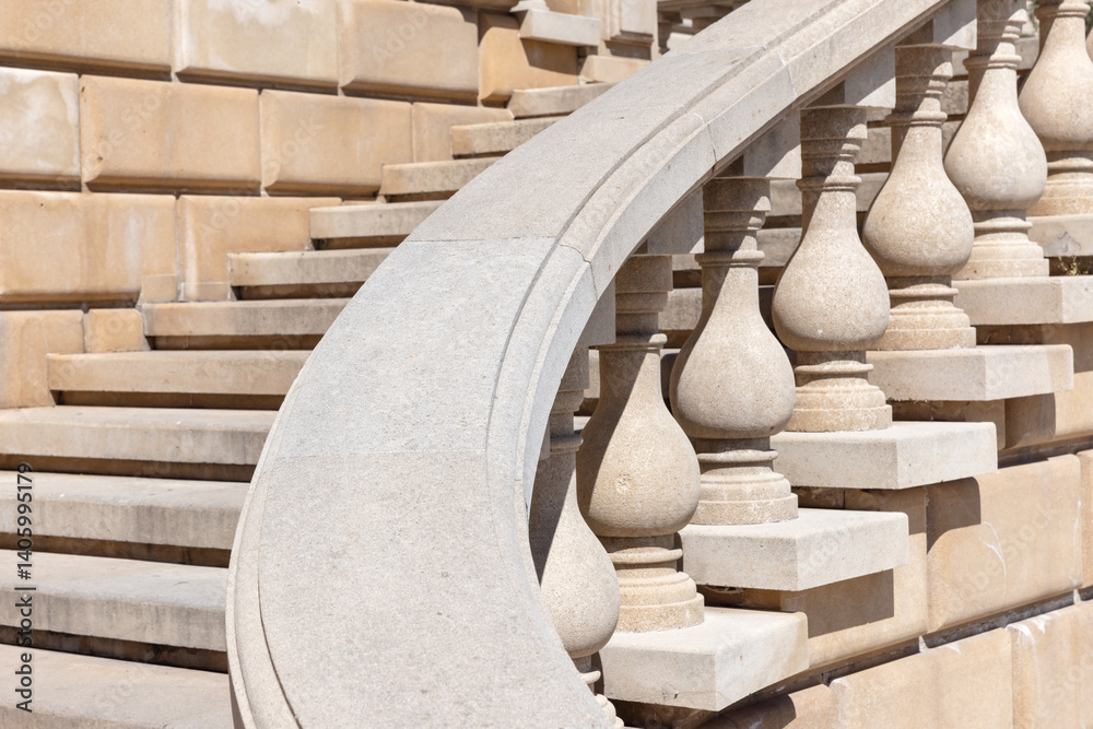Turning stone staircase with a beautifully designed balustrade