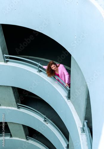 Woman having fun in a multistory parking building, high angle view