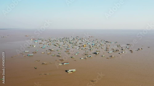 The beautiful floating village of Chong Kneas on Tonle Sap Lake in Asia, Cambodia, near Siem Reap, in summer on a sunny day.