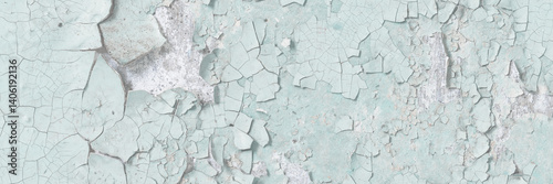 Obraz na płótnie Green peeling paint on the wall. Old concrete wall with cracked flaking paint. Weathered rough painted surface with patterns of cracks and peeling. High resolution texture for background and design. w salonie