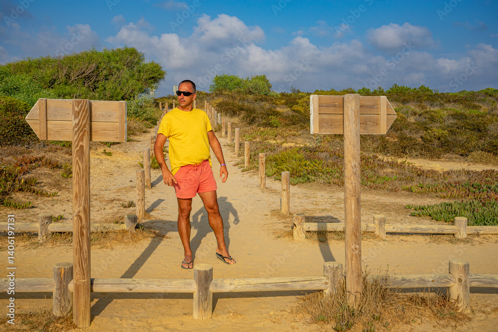 Caucasian man undecided on which direction to take. Caucasian man undecided on which direction to take.