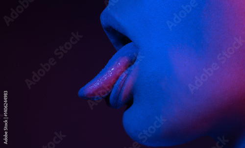Closeup of female sticking tongue out. Macro tongue lick. Close up of woman mouth with tongue. Sexy tongue. Sensual lick.