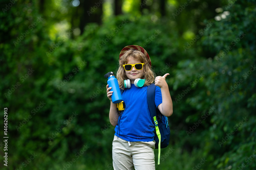 Child enjoying a picnic in summer. Kid Fun on camping. Little tourist on nature. Child enjoying summer camp. Kid exploring nature outdoors. Happy child on a camping trip. Picnic with kids.