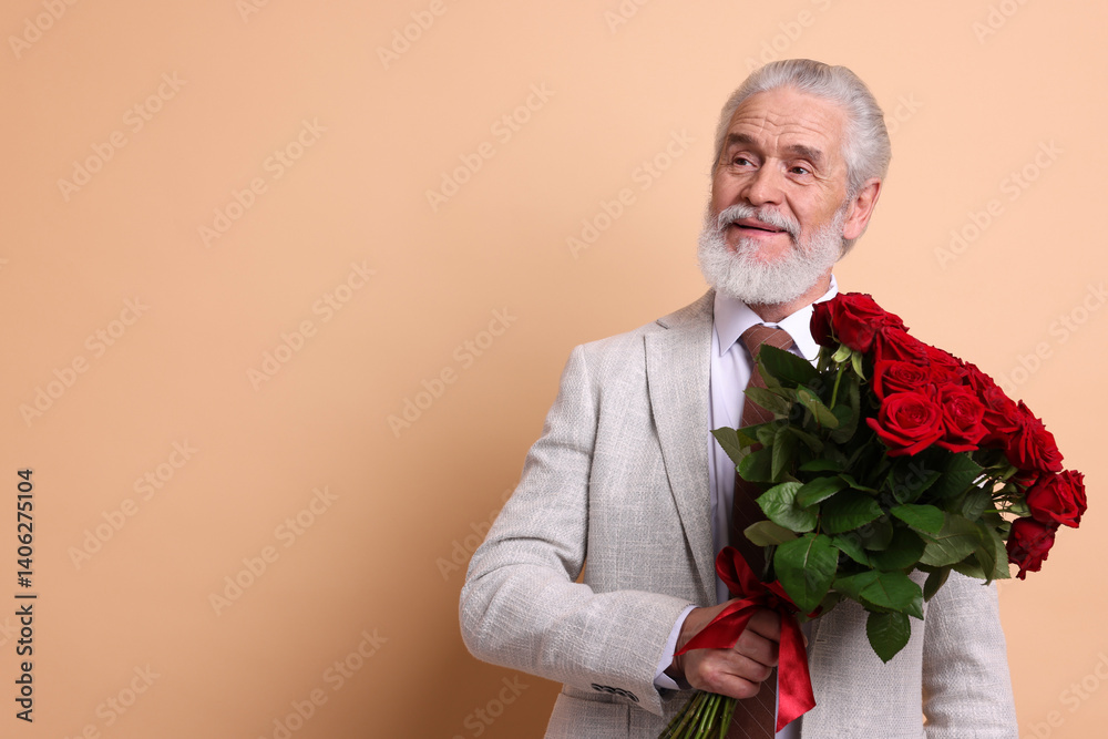 Senior man with bouquet of red roses on beige background, space for text Senior man with bouquet of red roses on beige background, space for text