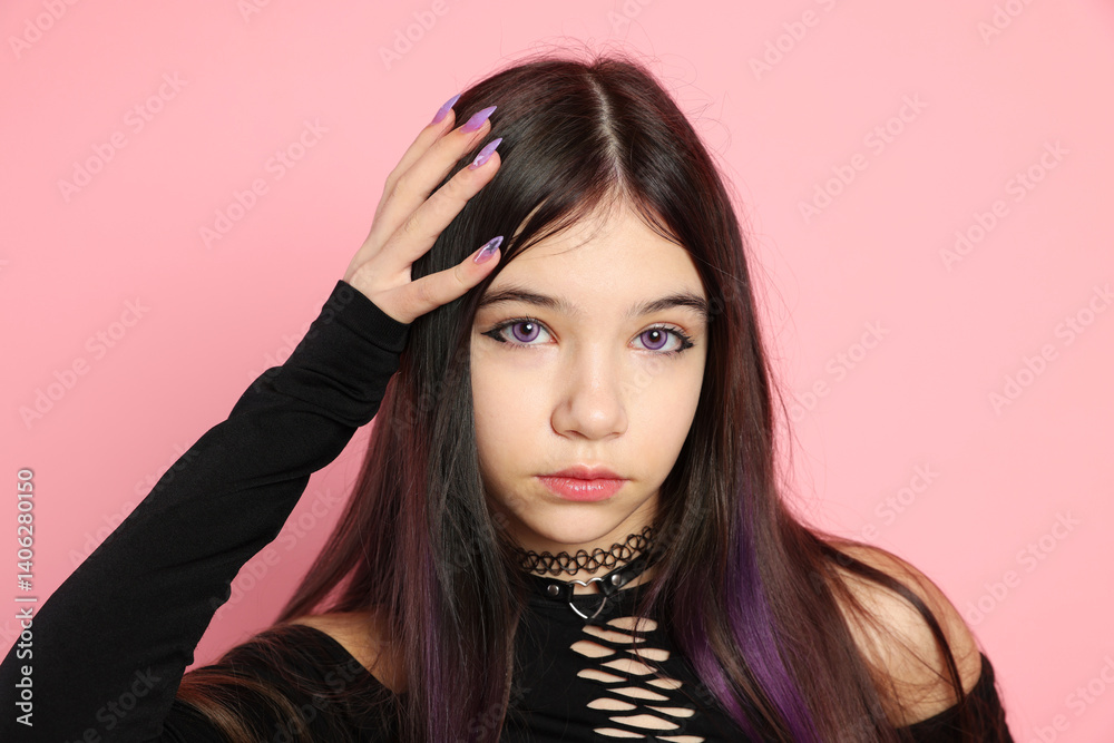 Teenage girl posing on pink background. Makeup and clothes in anime style Teenage girl posing on pink background. Makeup and clothes in anime style