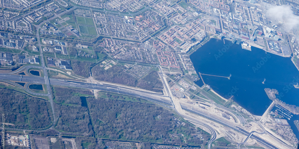 Netherlands, Holland, Dutch, Aerial view of city outskirts in the day from an aeroplane window