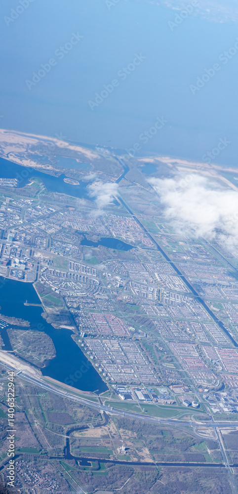 Netherlands, Holland, Dutch, Aerial view of city outskirts in the day from an aeroplane window