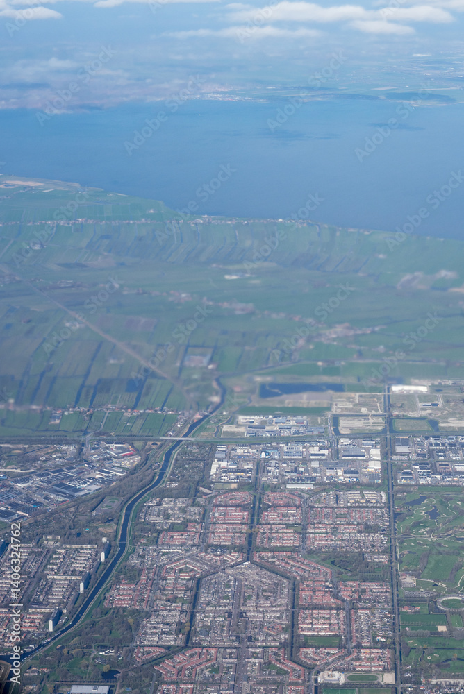Netherlands, Holland, Dutch, Aerial view of city outskirts in the day from an aeroplane window