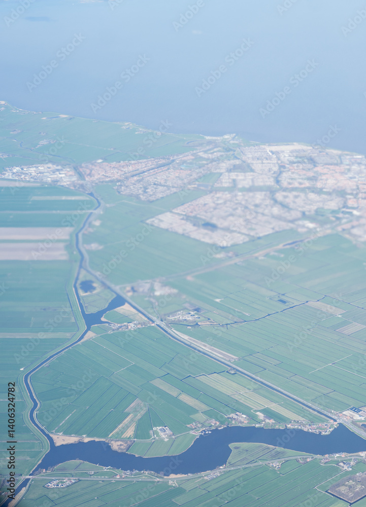 Netherlands, Holland, Dutch, Aerial view of city outskirts in the day from an aeroplane window