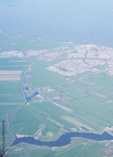Obraz na płótnie Netherlands, Holland, Dutch, Aerial view of city outskirts in the day from an aeroplane window w salonie
