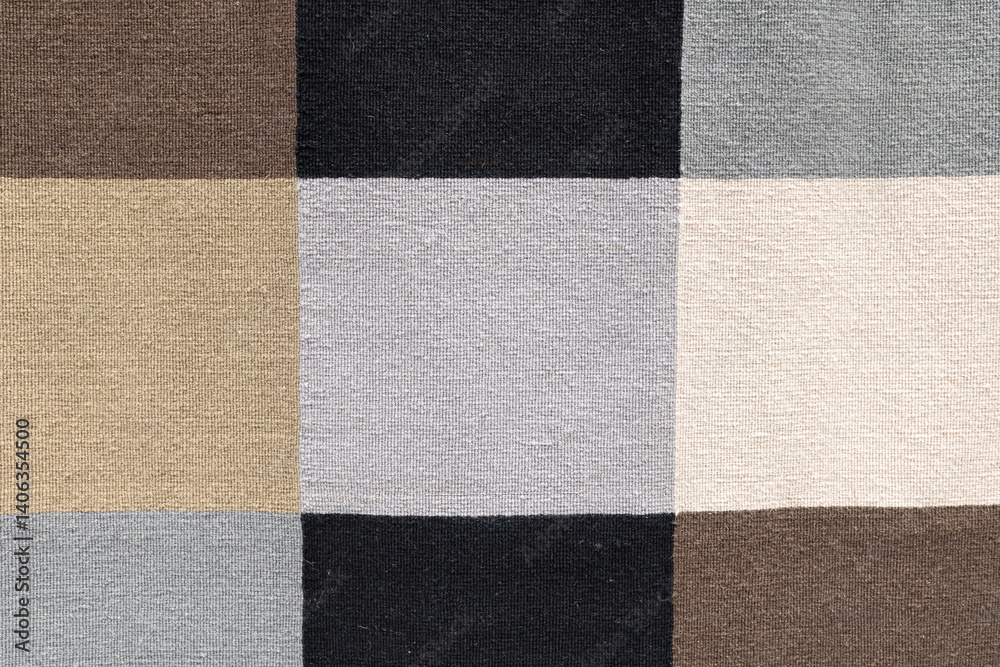 Fototapeta premium Neutral Toned Woven Fabric Checkerboard Pattern. textured woven fabric featuring a checkerboard pattern in neutral tones including beige, taupe, gray, black, and cream.