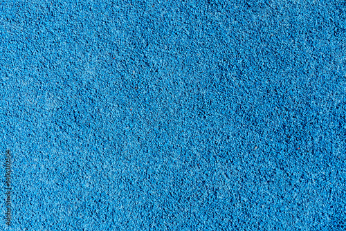 An eye-catching bright blue surface featuring a textured finish, suitable for recreational areas, play zones, or sports facilities, often used in parks or gyms