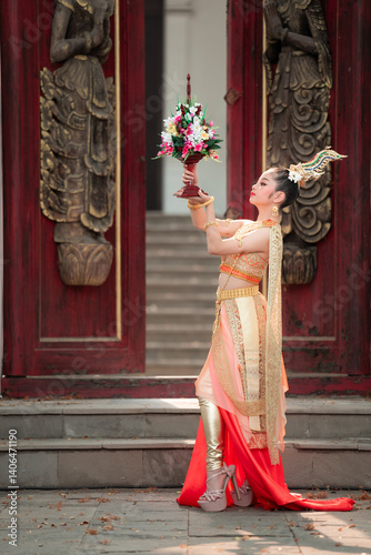 Outdoor portrait photography of teen in thai traditional dress at cultural heritage site
