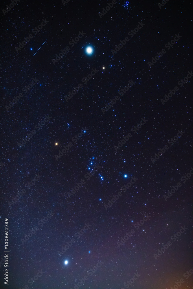 Real Milky way stars and Orion constellation photographed with a wide angle lens from a dark countryside location.