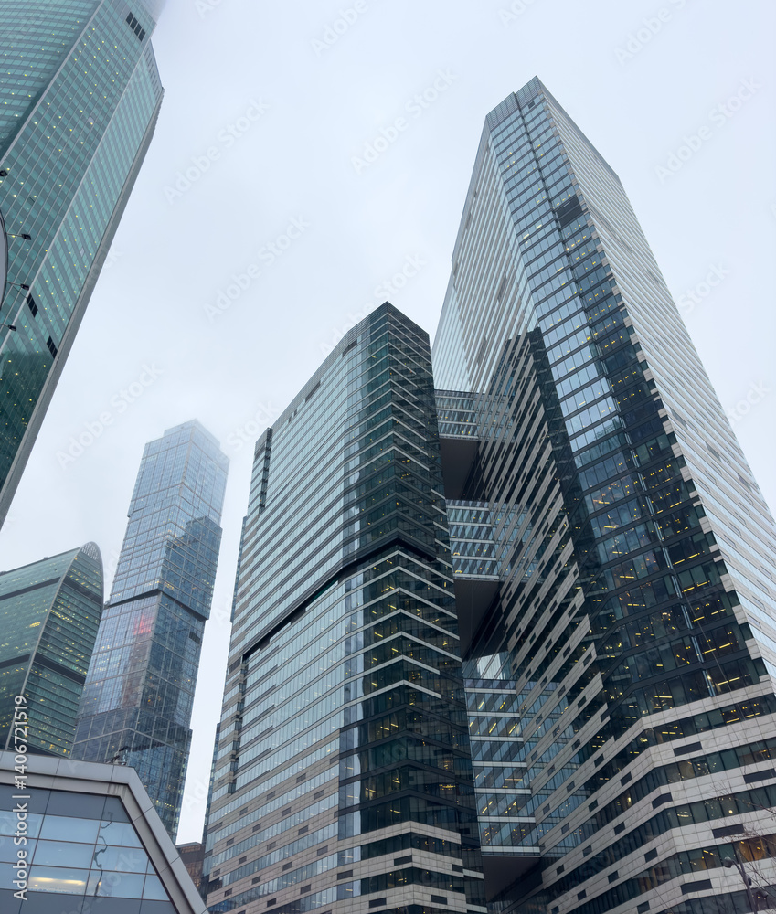 A city skyline with tall buildings and a cloudy sky A city skyline with tall buildings and a cloudy sky