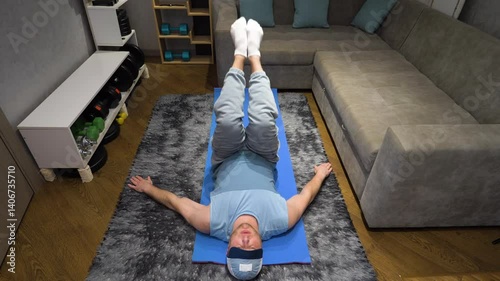 Exercise for the prostate and male potency Kegel. Male Pilates or yoga in the apartment. Workout on a fitness mat at home in the room. Warm-up warming up muscles. Slow motion.