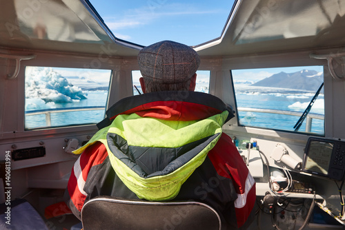 Obraz na płótnie Senior driver in an amphibious vehicle. Jokulsarlon, Southeast area. Iceland. w salonie