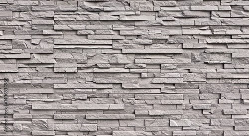 Warm earthy stone wall texture background exhibiting natural brown and subtle yellow hues for versatile design use