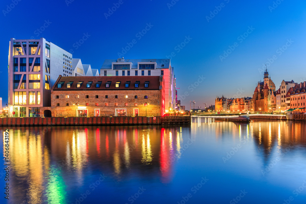 Beautiful old town of Gdansk with historic architecture at Motlawa river at night, Poland