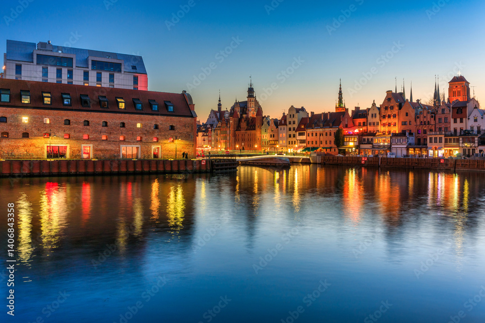 Beautiful old town of Gdansk with historic architecture at Motlawa river at night, Poland
