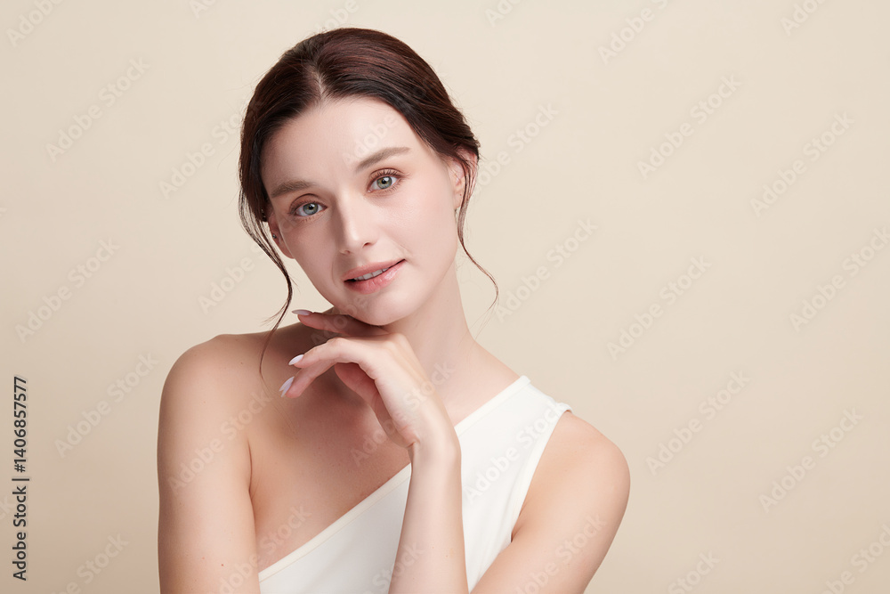 A beautiful young woman with clean, fresh skin against a beige background. Skincare, facial treatment, cosmetology, beauty, and spa. An elegant portrait of an woman. A beautiful young woman with clean, fresh skin against a beige background. Skincare, facial treatment, cosmetology, beauty, and spa. An elegant portrait of an woman.