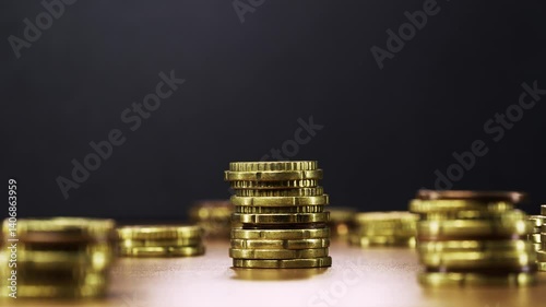Animated coin stacks reduce one by one in stop motion, symbolizing money loss and decline